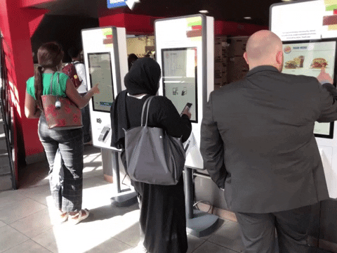 Another Animated GIF showing people using the ordering kiosks to place their orders at Burger King