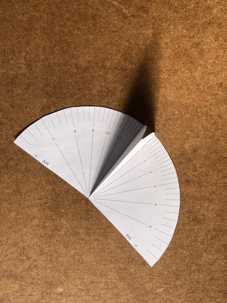 My paper sundial around 10:20am, about an hour after the first image. This time, the light was more diffused so the gnomons shadow wasn't as sharp